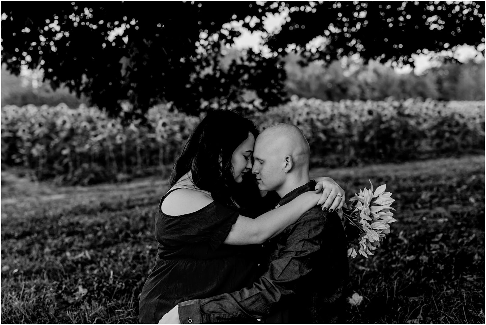 engagement session in sunflower field