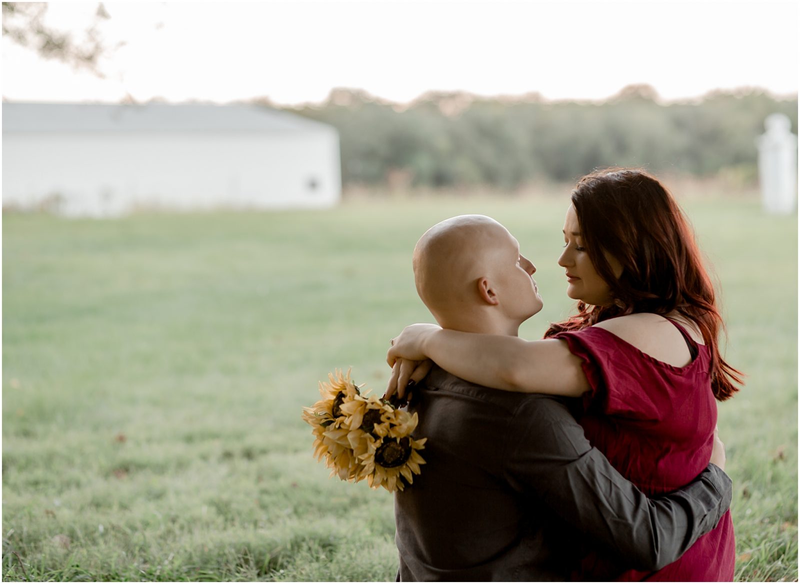 engagement session in sunflower field