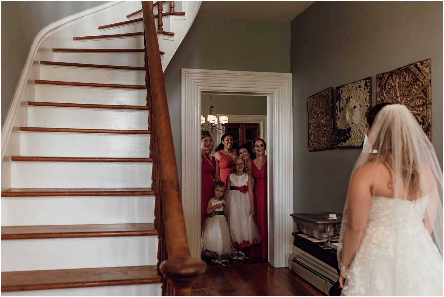 bridesmaids seeing bride in wedding dress for the first time